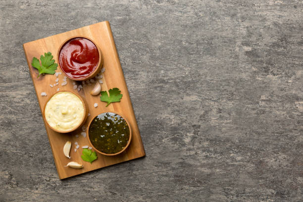 istock Many different sauces and herbs on table, flat lay top view. sauces on plate, healthy concept 1407399663
