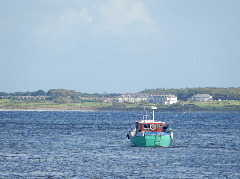 A ship and it's crew departing Galway, returning to their home at sea.