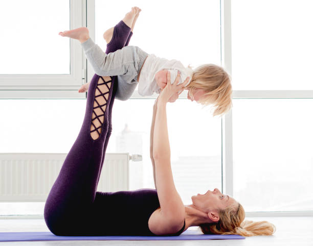 istock Mother and child practicing yoga 1407403468