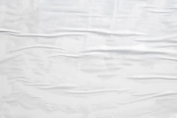 istock white crumpled and creased paper poster texture background 1407409227