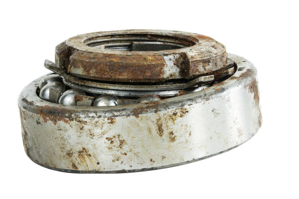 istock Bearing on a white background. Old worn bearing covered with rust 1407409969