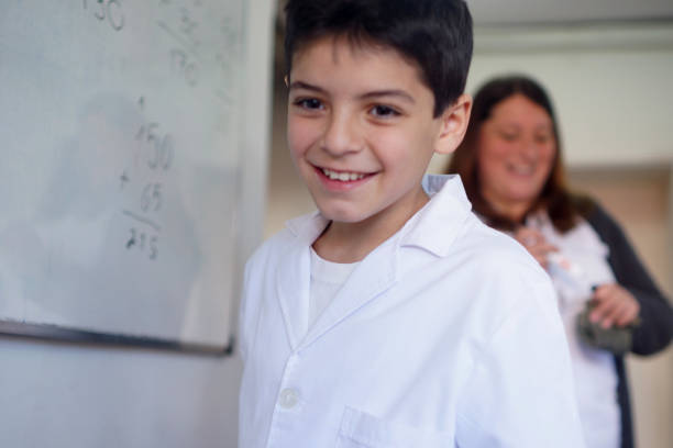 Students learning on the blackboard with the teacher