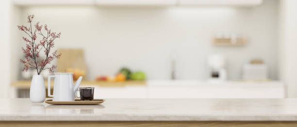 Modern kitchen countertop or tabletop with empty space over blurred kitchen in the background
