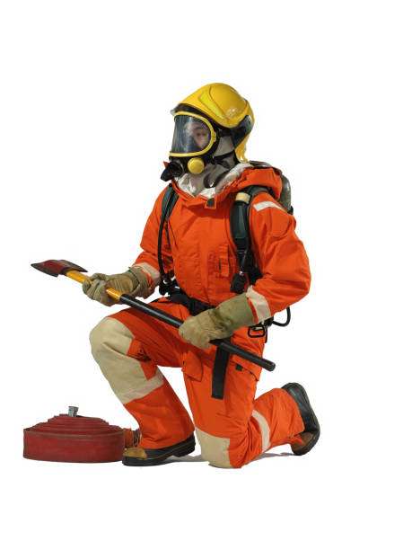 One Firemenan weraing heat protection suit and helmet breathing with oxygentank on white background hold axe and hose stand still action portrait action on fire fighting