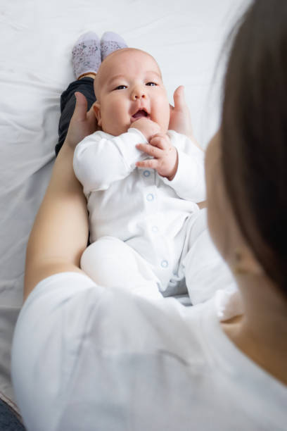istock asian mom and baby at home 1407436544