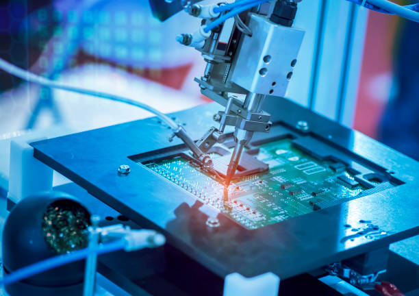 istock automatic robot for print circuit board (PCB)assembly machine during soldering or welding part 1407436597