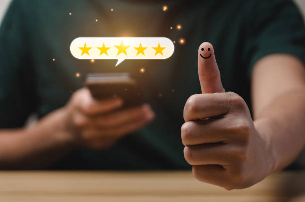 Customer satisfaction concept. Man hand using smartphone with five star pop-up icon for feedback. with copy space. 5 star satisfaction, Excellent business rating experience