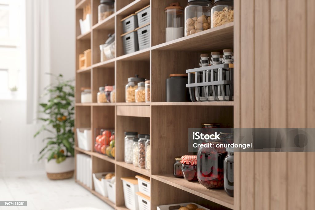 Close-up View Of Organised Pantry Items With Variety of Nonperishable Food Staples And Preserved Foods in Jars On Kitchen Shelf Pantry Stock Photo