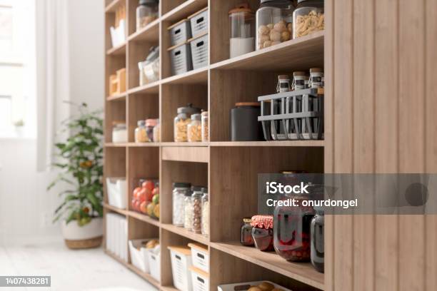 Closeup View Of Organised Pantry Items With Variety Of Nonperishable Food Staples And Preserved Foods In Jars On Kitchen Shelf Stock Photo - Download Image Now