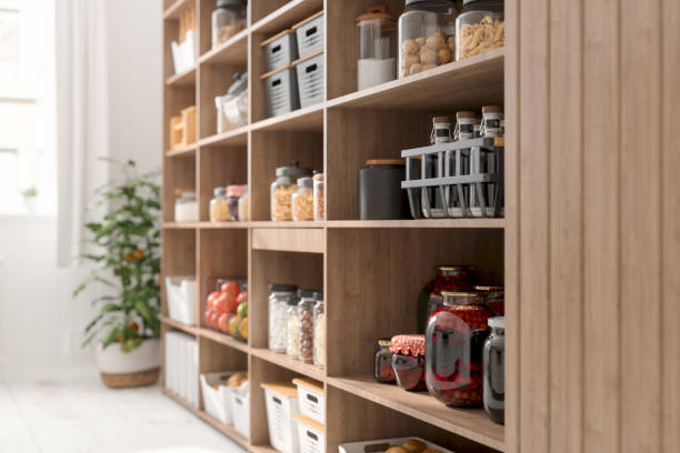 close-up view of organised pantry items with variety of nonperishable food staples and preserved foods in jars on kitchen shelf - cooking process imagens e fotografias de stock