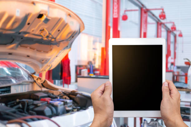 istock Close-up Of A Car Mechanic Using Digital Tablet,copy space for text. 1407439359