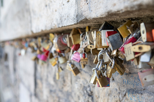 Love locks can be found all over Paris - seen here on a wall by the Seine River