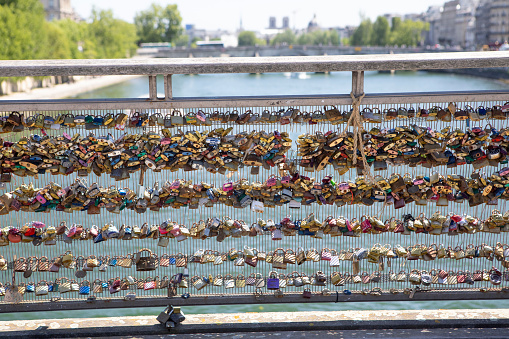 Love locks can be found all over Paris - seen here on Passerelle Léopold-Sédar-Senghor