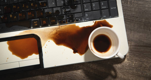 istock Coffee spilled over laptop keyboard. 1407441146