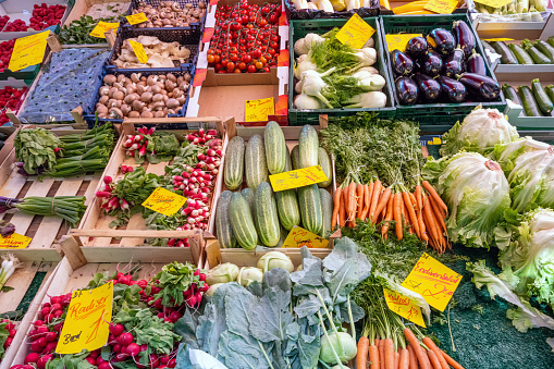 Bunch of fresh artichoke on traditional food market stall in Bologna, Italy