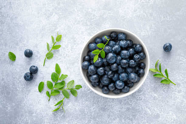 istock Blueberry with leaves in a bowl 1407444735