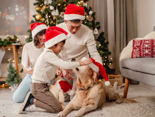 istock Family near christmas tree while dog is passing by 1407448581