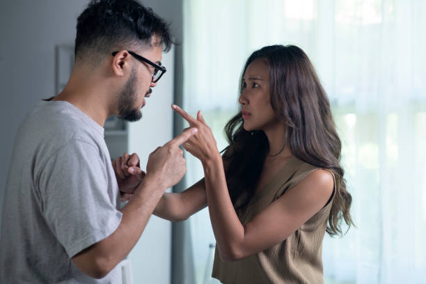 istock Asian couple arguing shouting blaming each other of problem. 1407449940