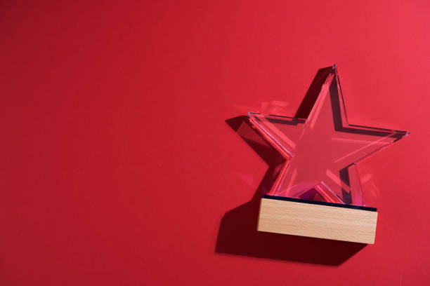 istock star shape of crystal trophy against red background 1407449959