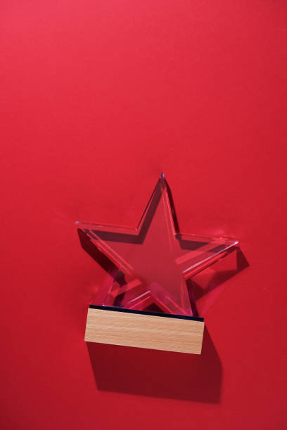 istock star shape of crystal trophy against red background 1407449969