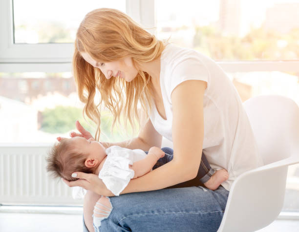istock Mother holding child 1407449985