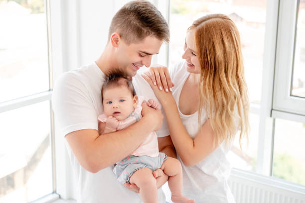 istock Couple with baby 1407450009