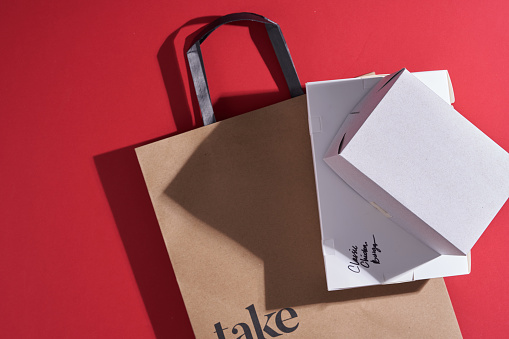 take away paper with boxes with food- mobile delivery service