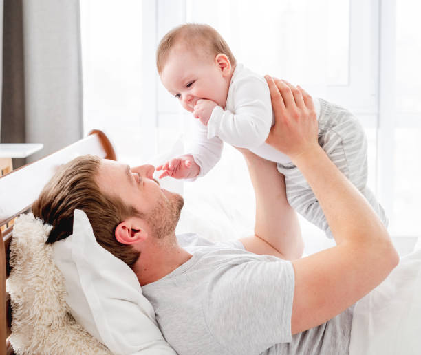 istock Father with son in the bed 1407451156