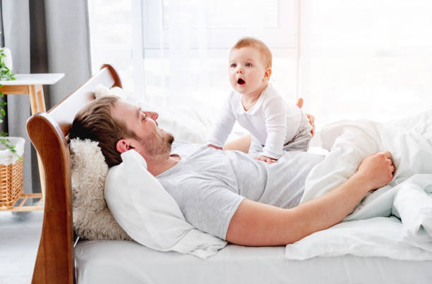 istock Father with son in the bed 1407451159