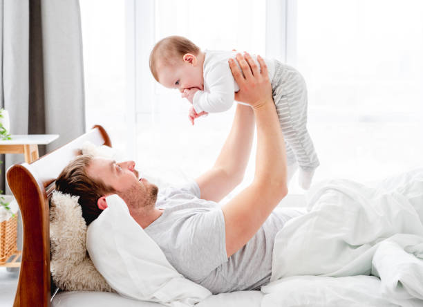 istock Father with son in the bed 1407451165