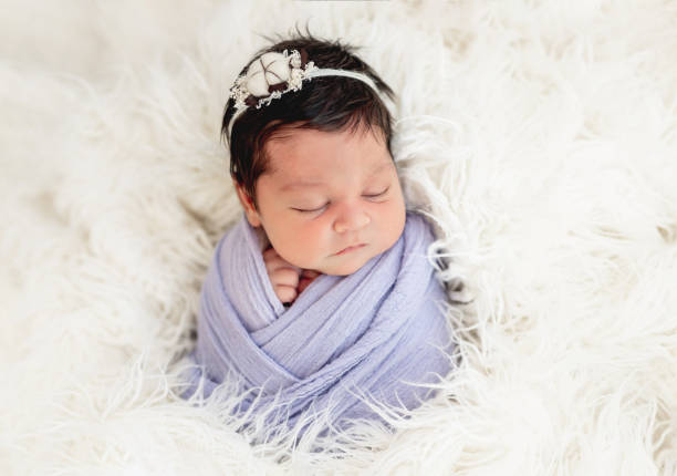 istock Smiling newborn in knitted hat 1407451296