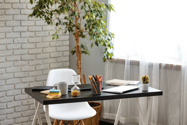 istock Office desk with stationery items and laptop 1407452040