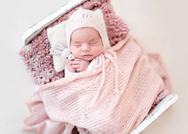 istock Top view of cute sleeping newborn 1407452460