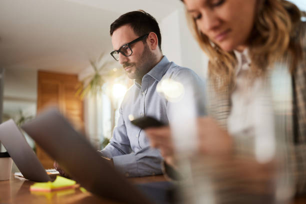 istock Young colleagues working at casual office. 1407453205