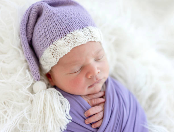 istock Cute newborn in knitted hat 1407453310
