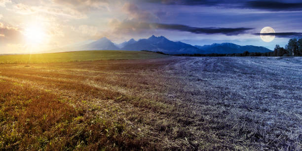 istock day and night time change above rural landscape. 1407453683