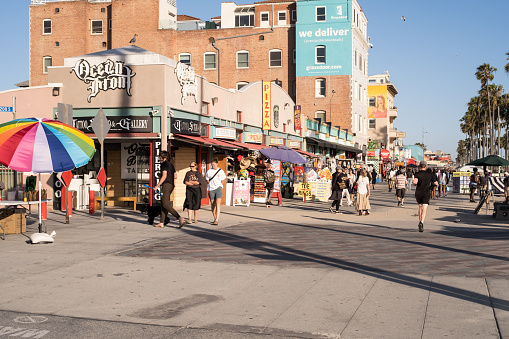 Los Angeles, USA - May 12th, 2022: People enjoying Venice Beach late in the day.