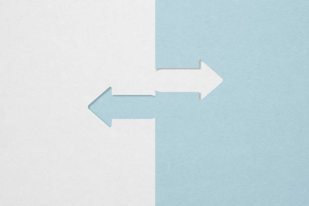 istock opposite directions arrow paper cut grey and blue with copy space 1407454762