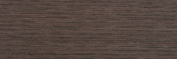 istock Dark grey oak veneer. Natural wood texture, long veneer sheet. 1407456393