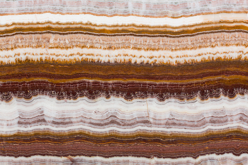 The structure of the variegated onyx with a natural crack. High resolution photo.