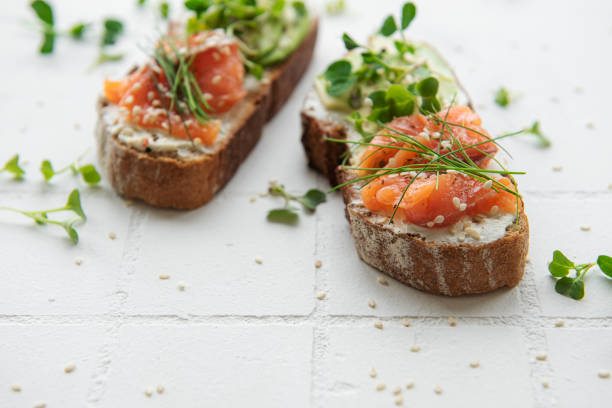 istock Sandwiches with salted salmon,  avocado and microgreens. 1407459035