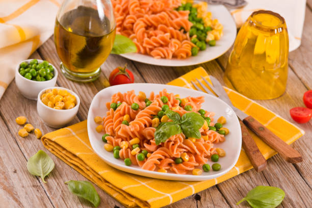 istock Fusilli pasta with peas and sweet corn. 1407459174