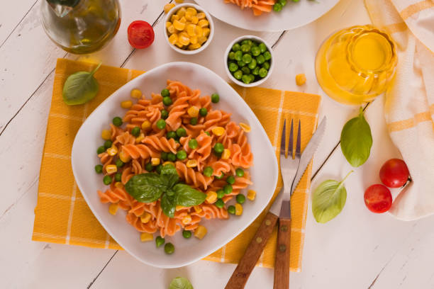 istock Fusilli pasta with peas and sweet corn. 1407459294