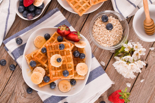 istock Waffles with blueberries, bananas and honey. 1407460113
