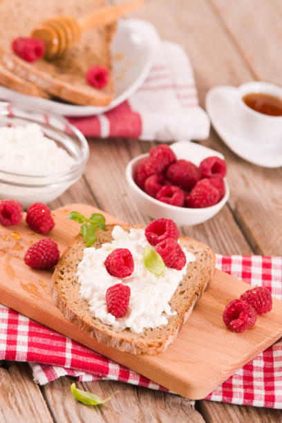 istock Rye bread with cottage cheese and raspberries. 1407461752