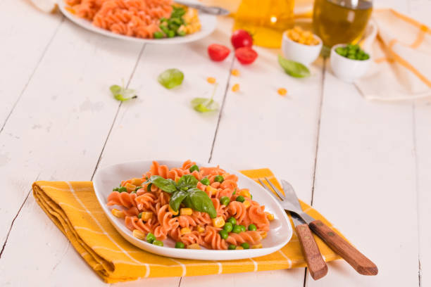istock Fusilli pasta with peas and sweet corn. 1407461792