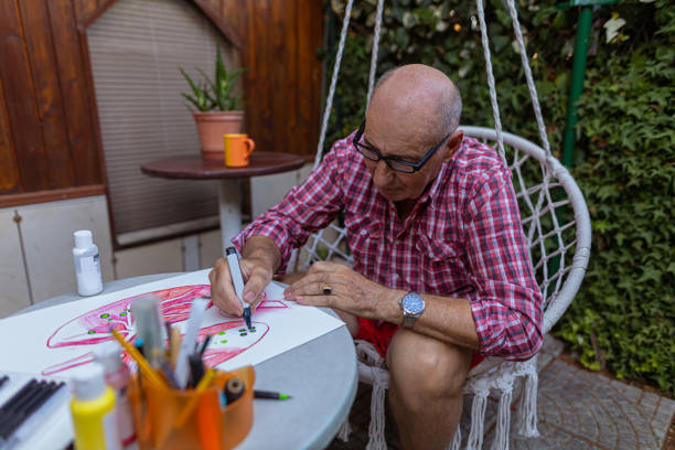istock Retired man focusing on outlining elements for Lung cancer awareness 1407461899