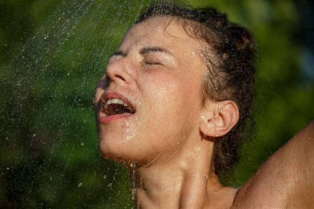 istock Woman showering outdoor 1407470077