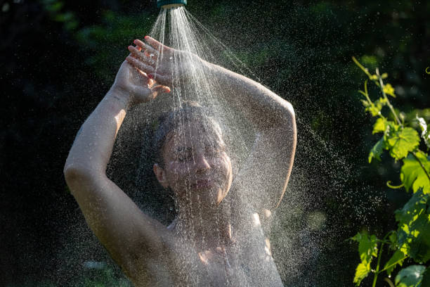istock Woman showering outdoor 1407471482
