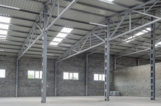 istock Empty warehouse. Brick walls, windows in the walls and ceiling. Modern interior of a warehouse, factory. 1407472043